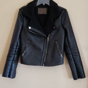 Black vegan leather jacket.
